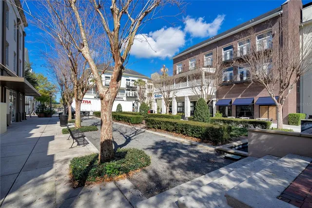 a front view of a building with sitting area