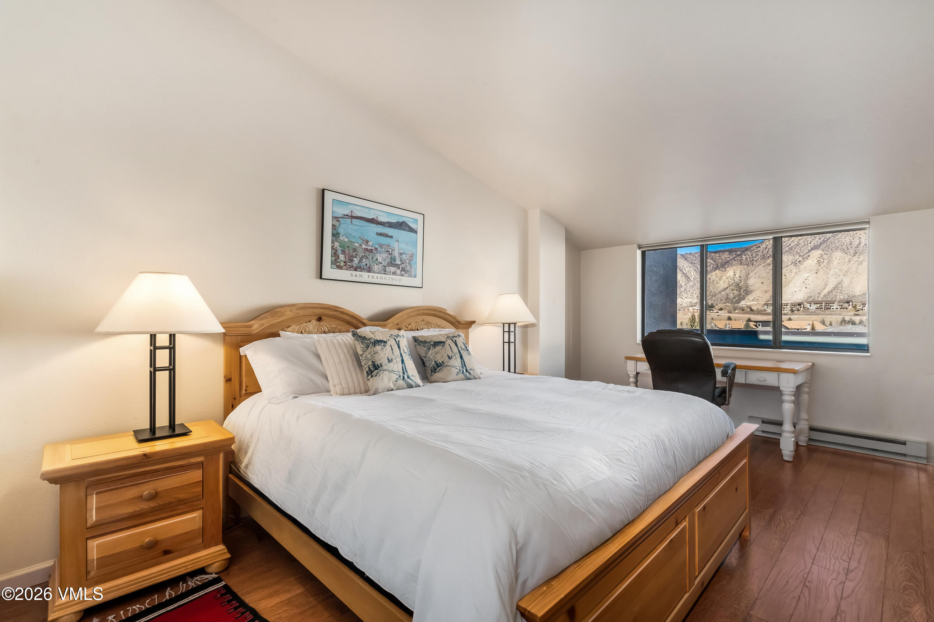 137 Benchmark Road, Unit 605 Avon, CO 81620 - Photo 15 of 30 a bedroom with a bed and a desk