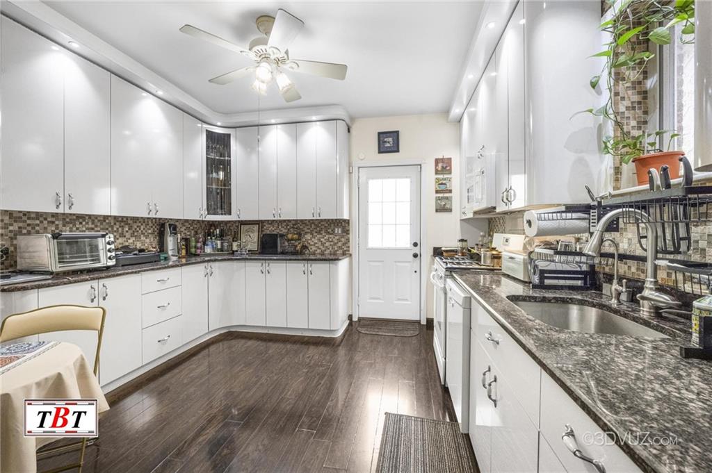 2515 Avenue R Brooklyn, NY 11229 - Photo 17 of 30 a kitchen with granite countertop a sink a counter space appliances and cabinets
