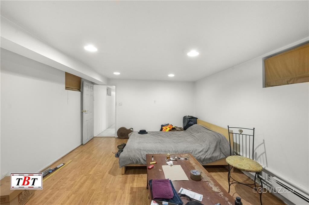 2515 Avenue R Brooklyn, NY 11229 - Photo 22 of 30 a bed room with a bed and furniture