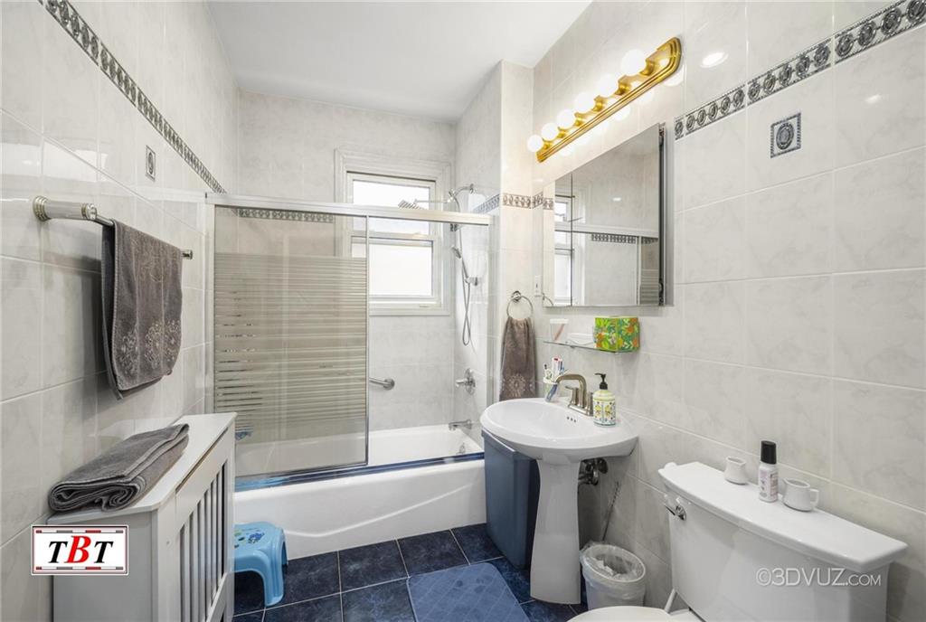 2515 Avenue R Brooklyn, NY 11229 - Photo 23 of 30 a bathroom with a sink a toilet and shower