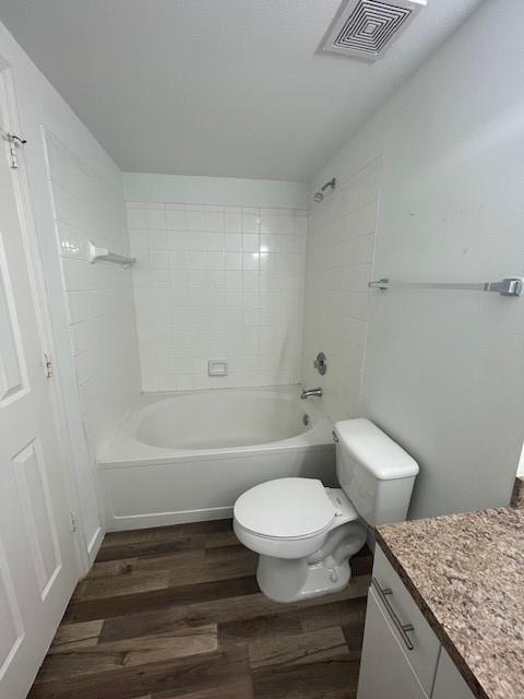 11630 Southwest 2nd Street, Unit 17202 Hollywood, FL 33025 - Photo 6 of 7 a bathroom with a granite countertop toilet a sink and bathtub