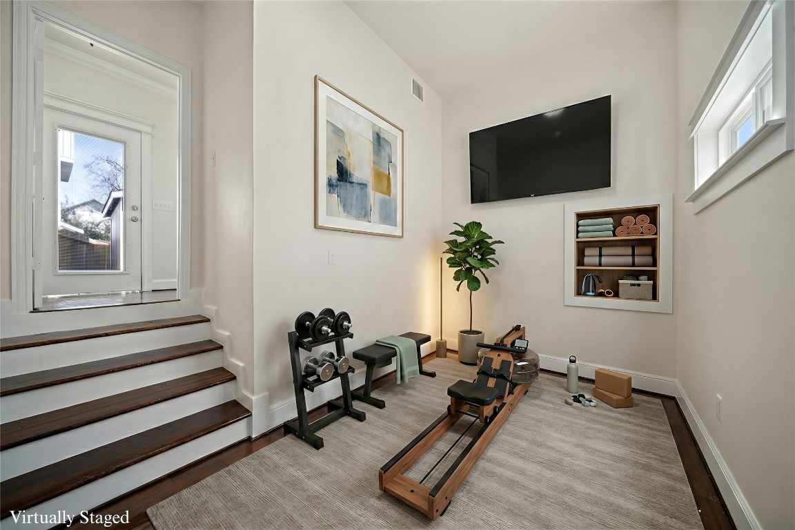 110 Kendall Street Houston, TX 77003 - Photo 23 of 36 a living room with furniture and a flat screen tv