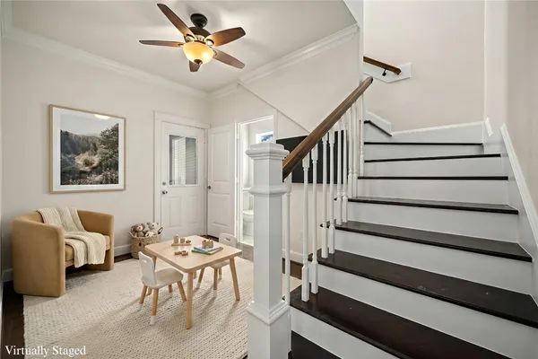 a view of entryway and hall with wooden floor