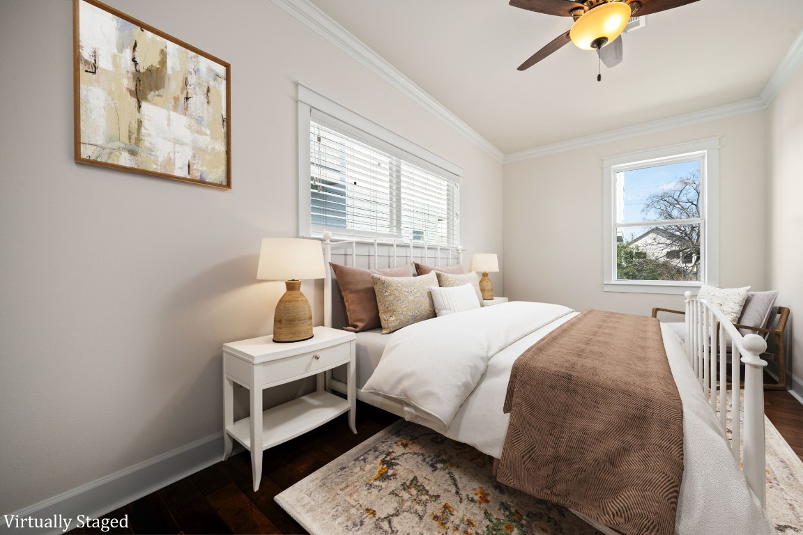 110 Kendall Street Houston, TX 77003 - Photo 28 of 36 a bedroom with a bed and a chandelier