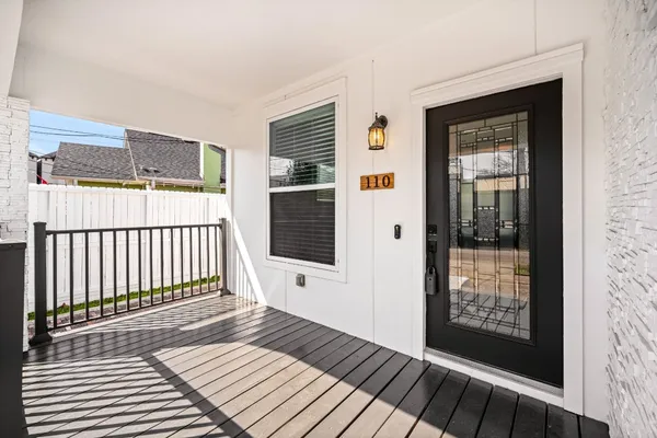 a view of a balcony with wooden floor