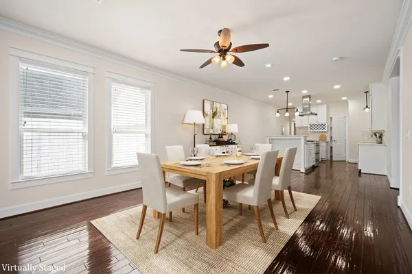 a view of a dining room with furniture window and wooden floor