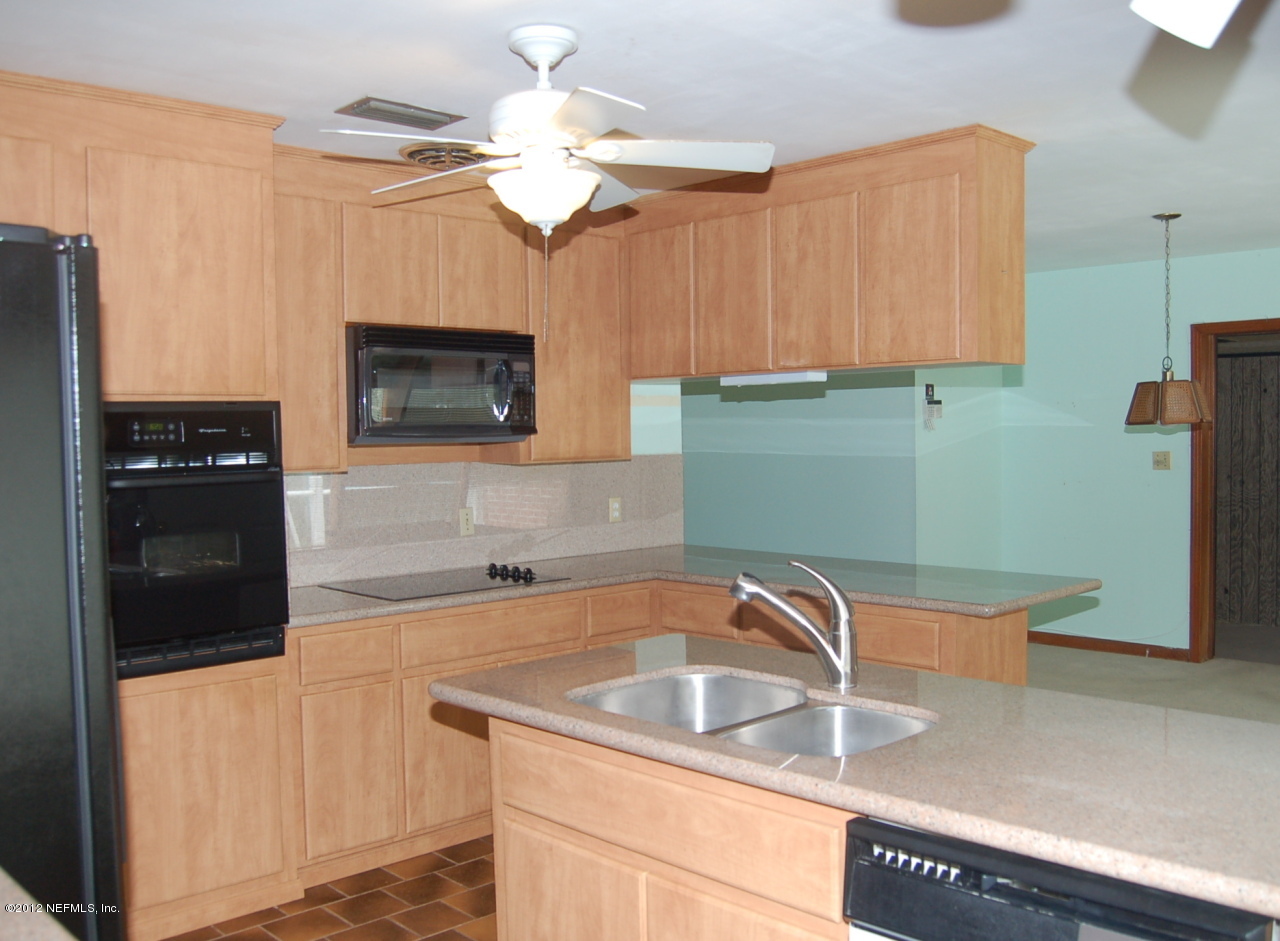 7347 Hennessy Road Jacksonville, FL 32244 - Photo 6 of 14 Kitchen to Dining Room