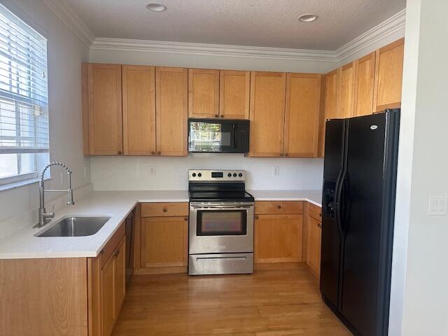 2502 North Dixie Highway, Unit 49 Lake Worth, FL 33460 - Photo 2 of 12 a kitchen with granite countertop a refrigerator and a sink
