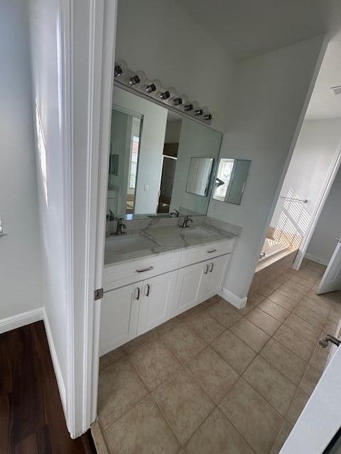 2502 North Dixie Highway, Unit 49 Lake Worth, FL 33460 - Photo 5 of 12 a view of a bathroom with mirror and sink