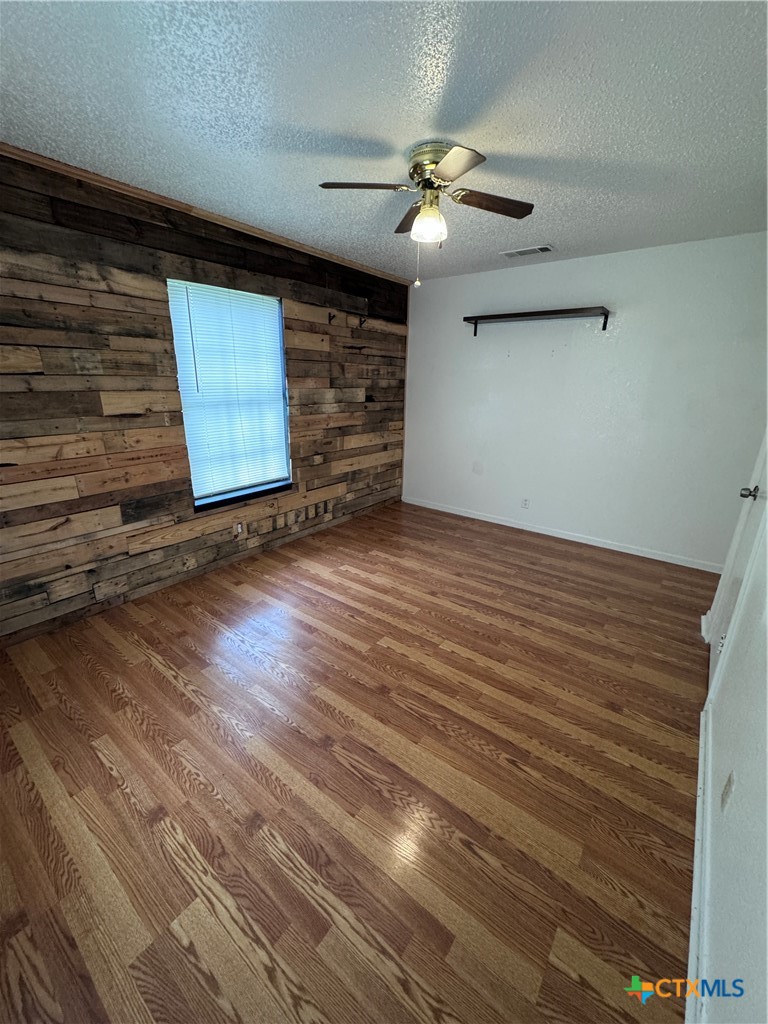 1301 North 10th Street Temple, TX 76501 - Photo 11 of 25 wooden floor in an empty room
