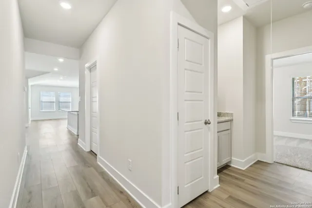 wooden floor with white walls