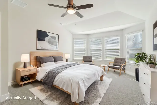 an empty room with a ceiling fan