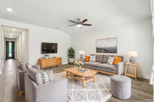 a living room with furniture and a flat screen tv
