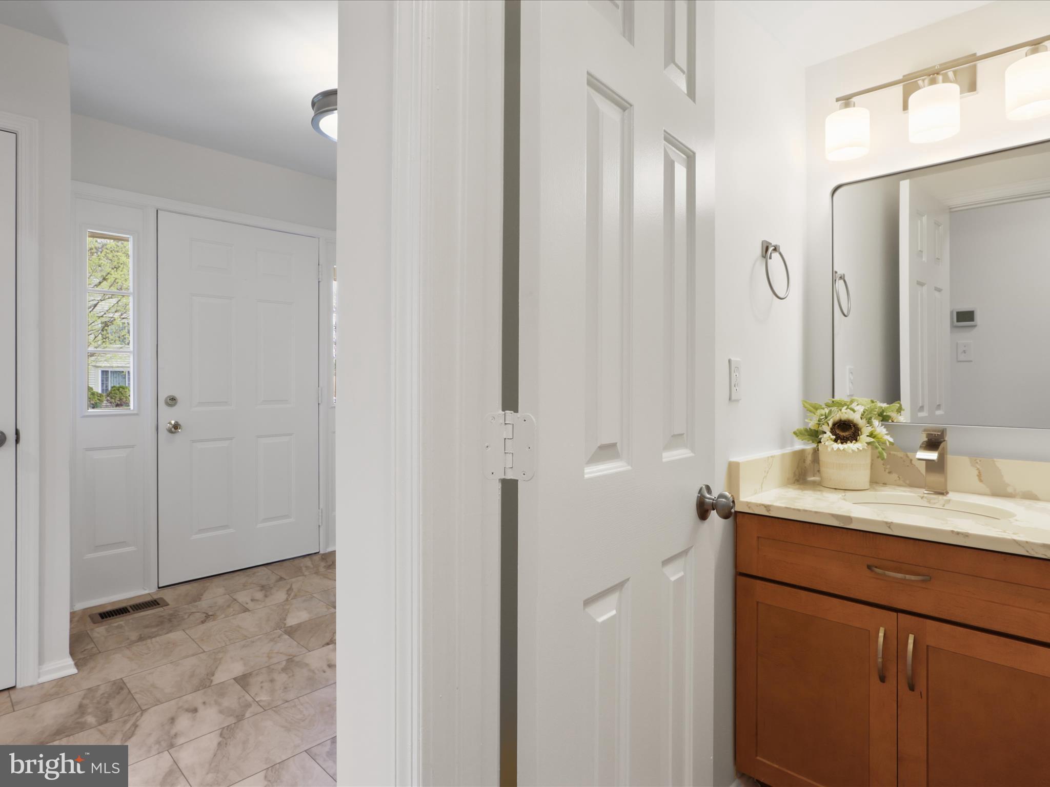 332 Silver Ridge Drive Sterling, VA 20164 - Photo 24 of 53 a bathroom with a sink and a mirror