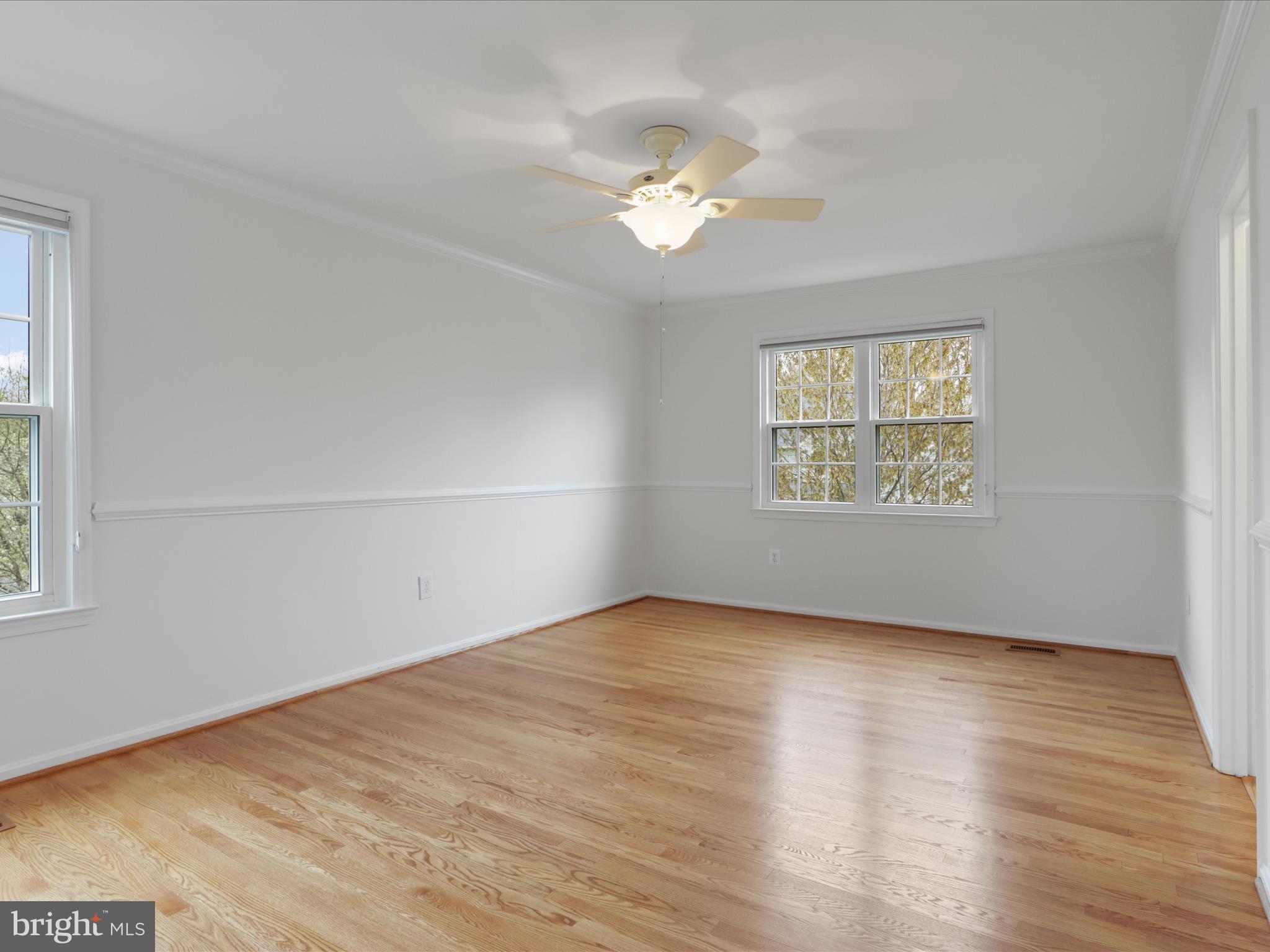 332 Silver Ridge Drive Sterling, VA 20164 - Photo 31 of 53 a view of an empty room with wooden floor and a window