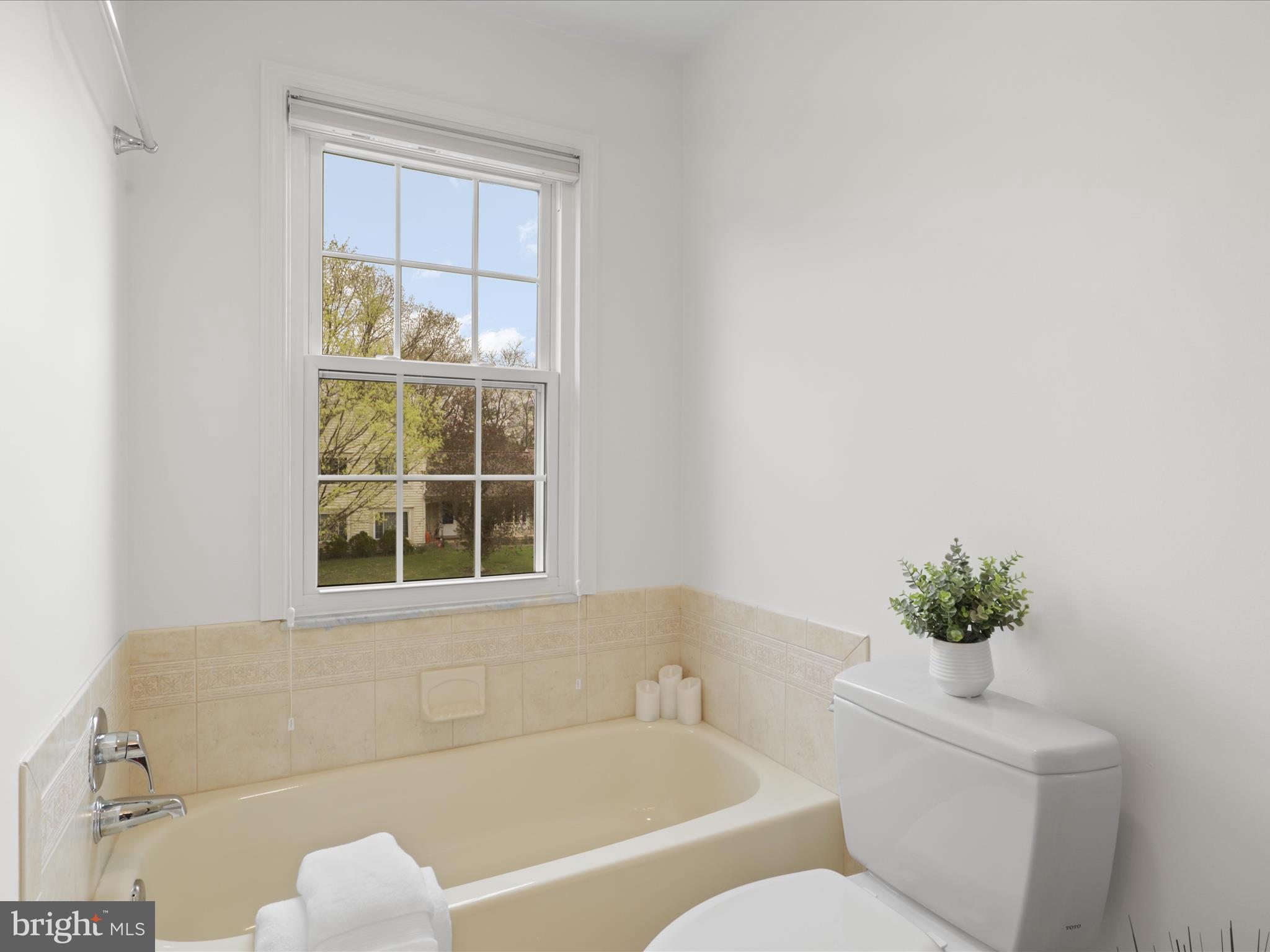 332 Silver Ridge Drive Sterling, VA 20164 - Photo 34 of 53 a bath tub sitting next to a white sink