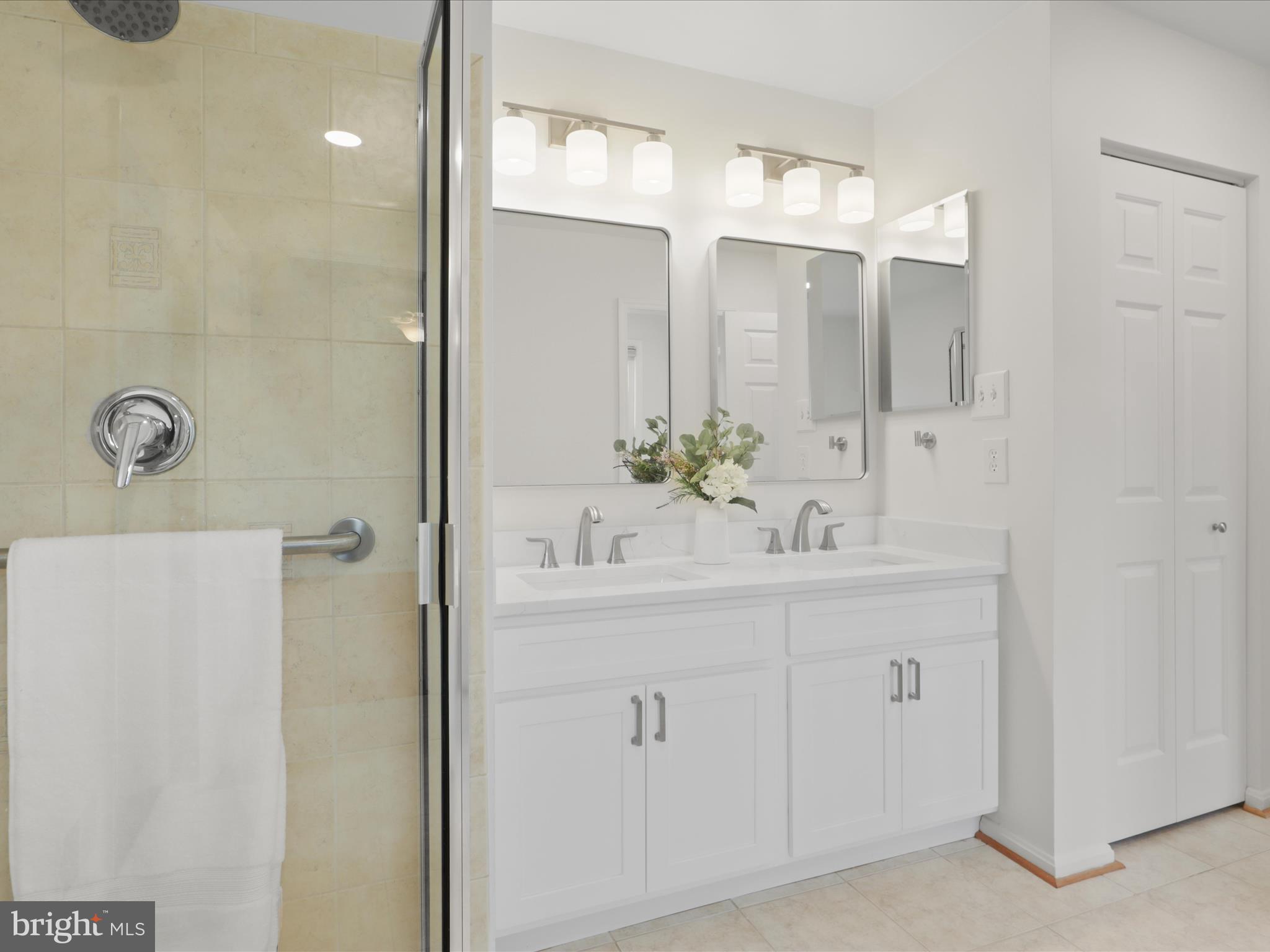 332 Silver Ridge Drive Sterling, VA 20164 - Photo 35 of 53 a bathroom with a sink vanity and mirror