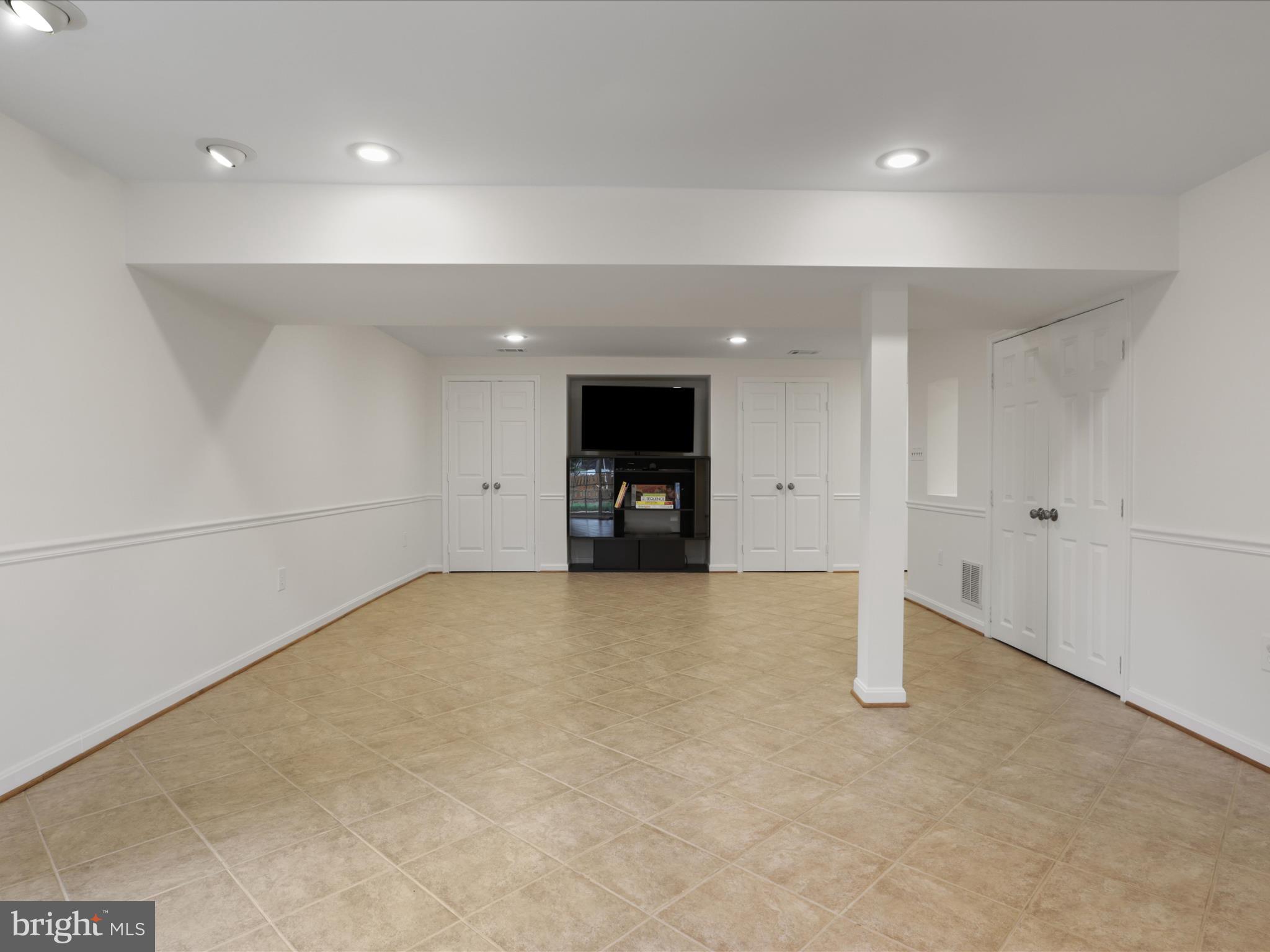 332 Silver Ridge Drive Sterling, VA 20164 - Photo 41 of 53 an empty room with entrance and wooden door