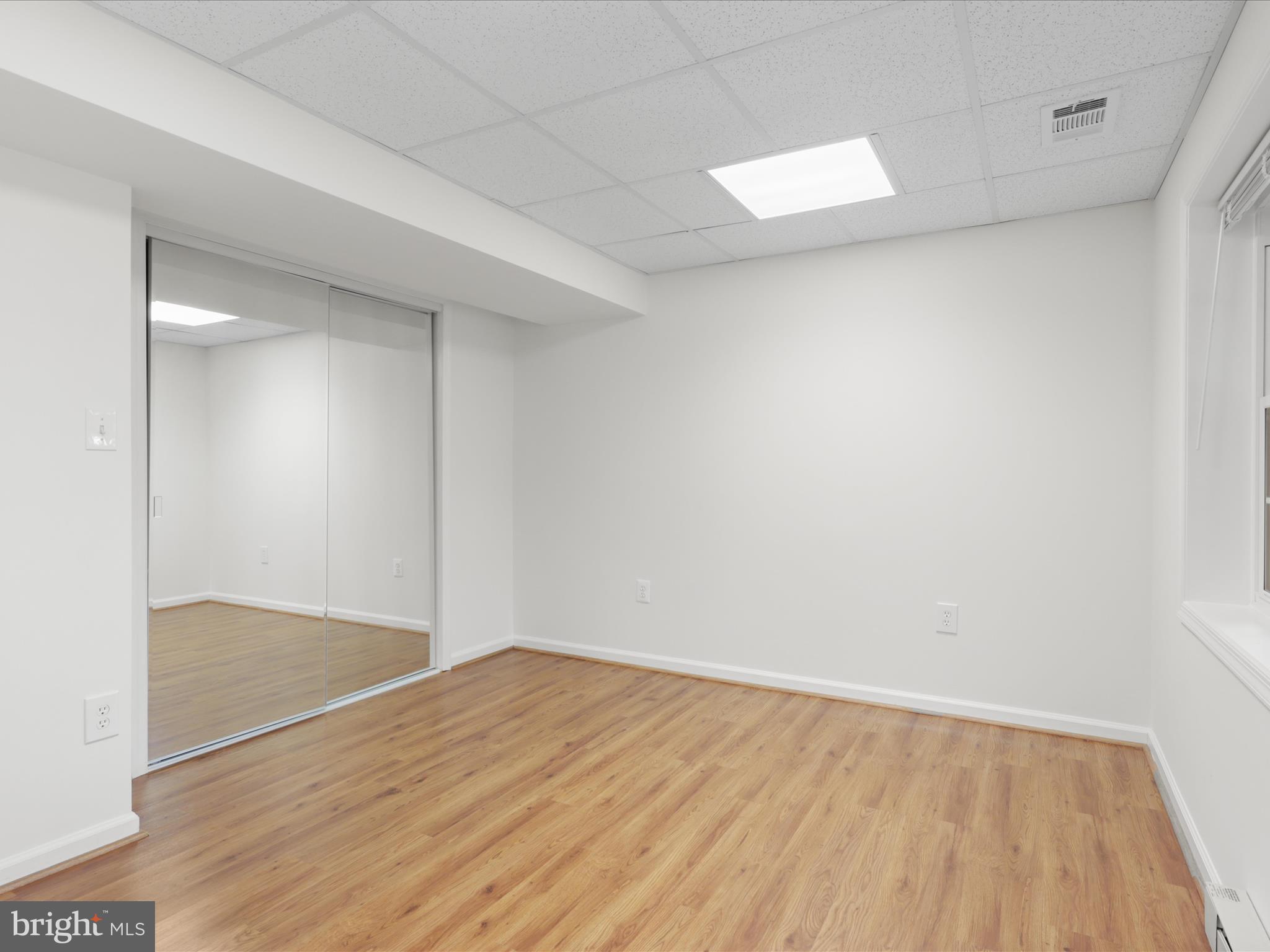 332 Silver Ridge Drive Sterling, VA 20164 - Photo 42 of 53 an empty room with wooden floor