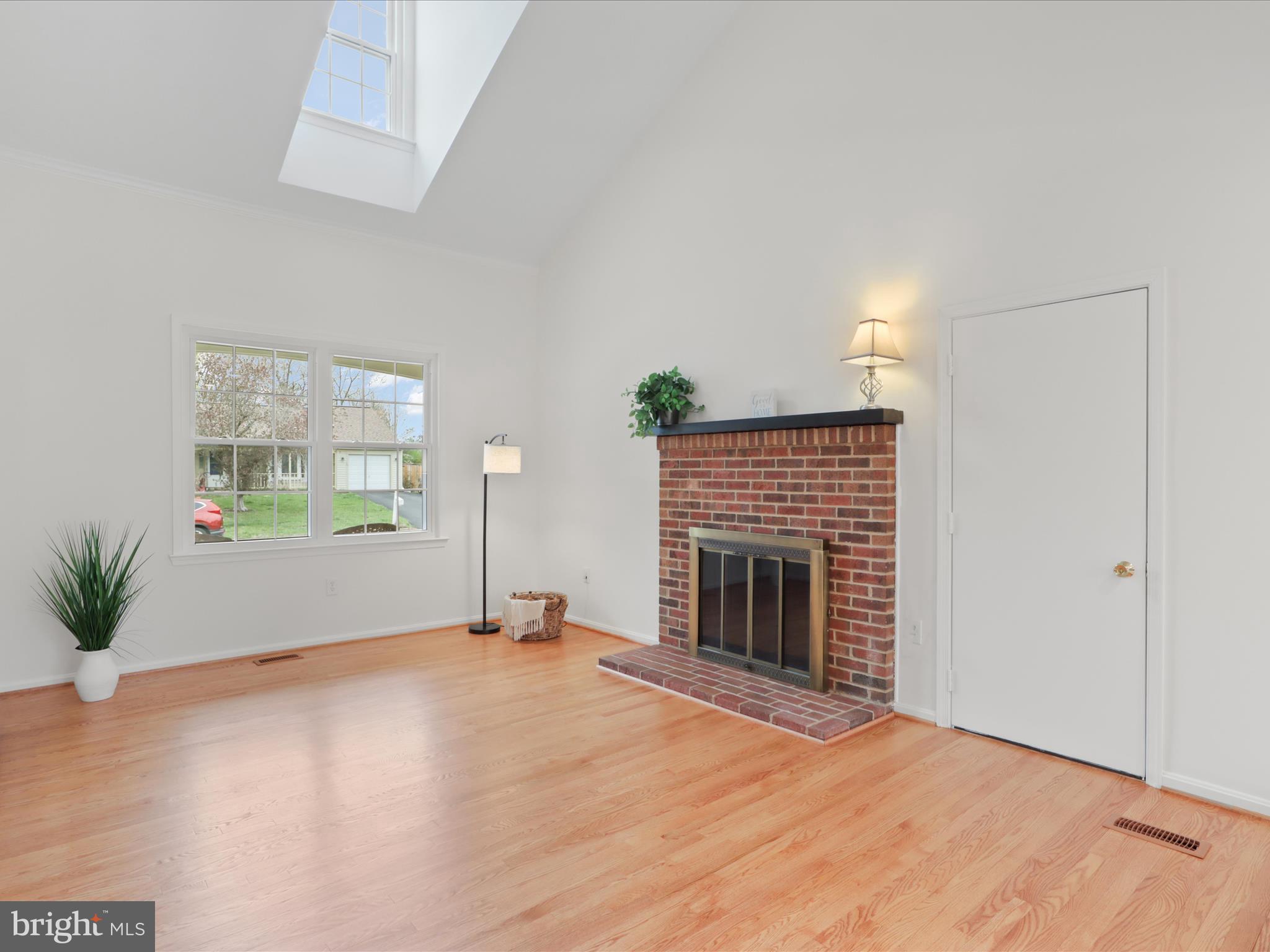 332 Silver Ridge Drive Sterling, VA 20164 - Photo 10 of 53 an empty room with windows and fireplace