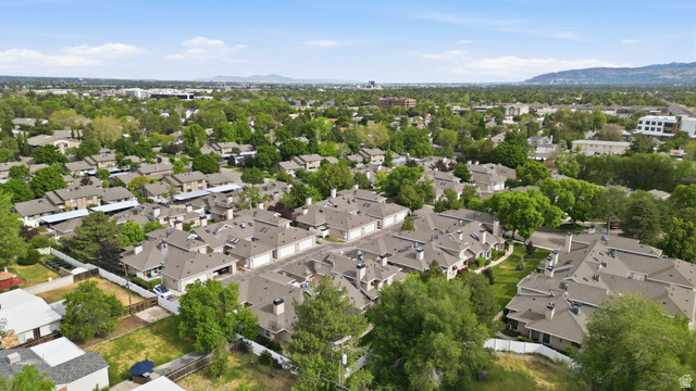 6969 South 855 East Midvale, UT 84047 - Photo 40 of 55 Expansive residential development featuring multiple units with individual garages and uniform grey roofing