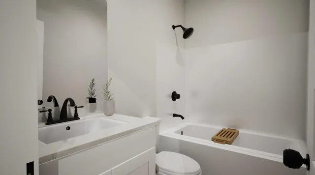 a bathroom with a sink a toilet and a bathtub