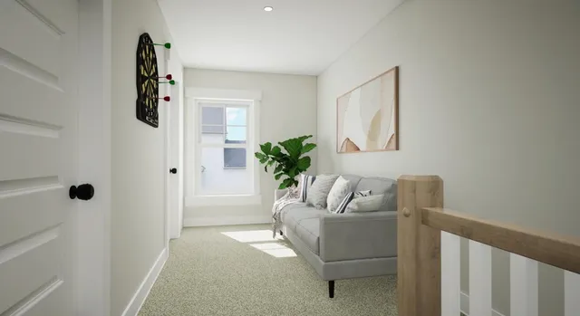 a living room with furniture and a potted plant