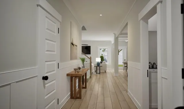 a dining room with furniture and wooden floor