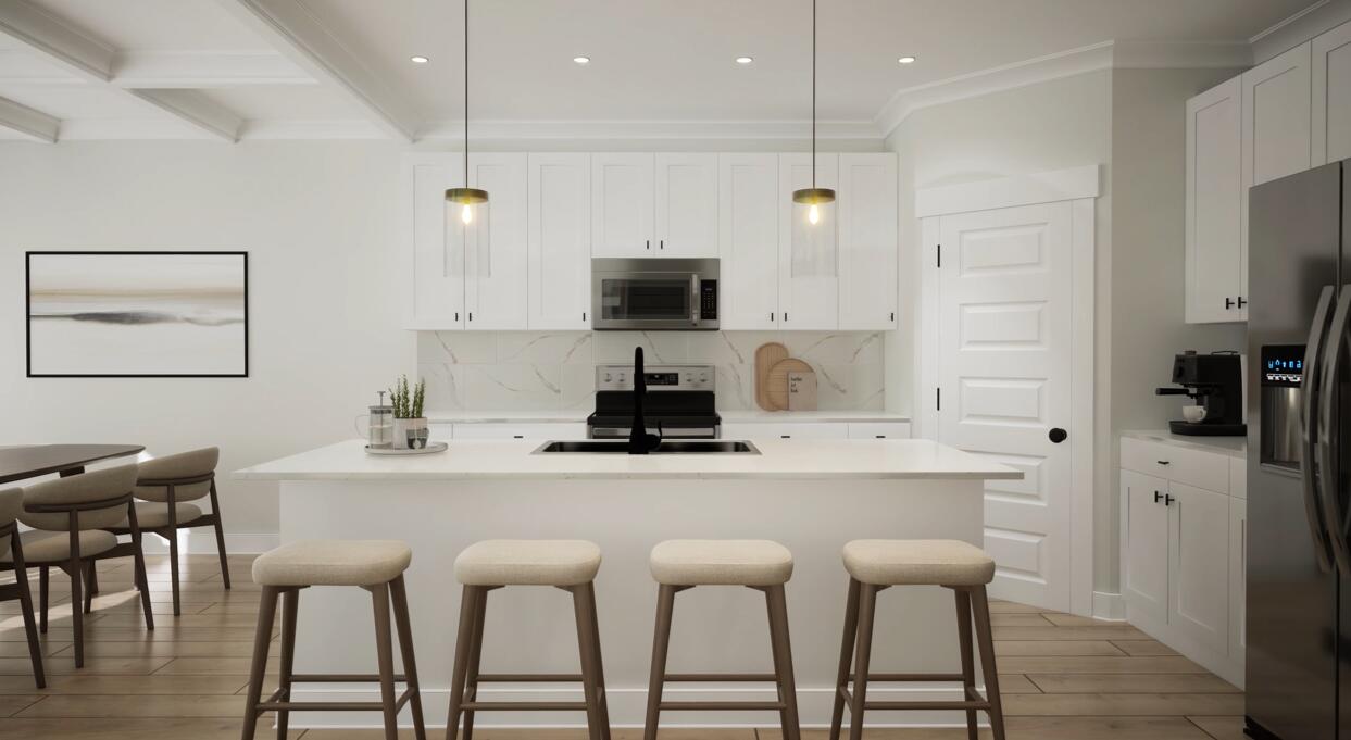 Lot 31 Spirit Bear Way Freeport, FL 32439 - Photo 8 of 29 a kitchen with stainless steel appliances kitchen island granite countertop a dining table and chairs