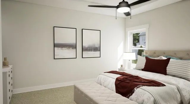 a bedroom with a bed and a window