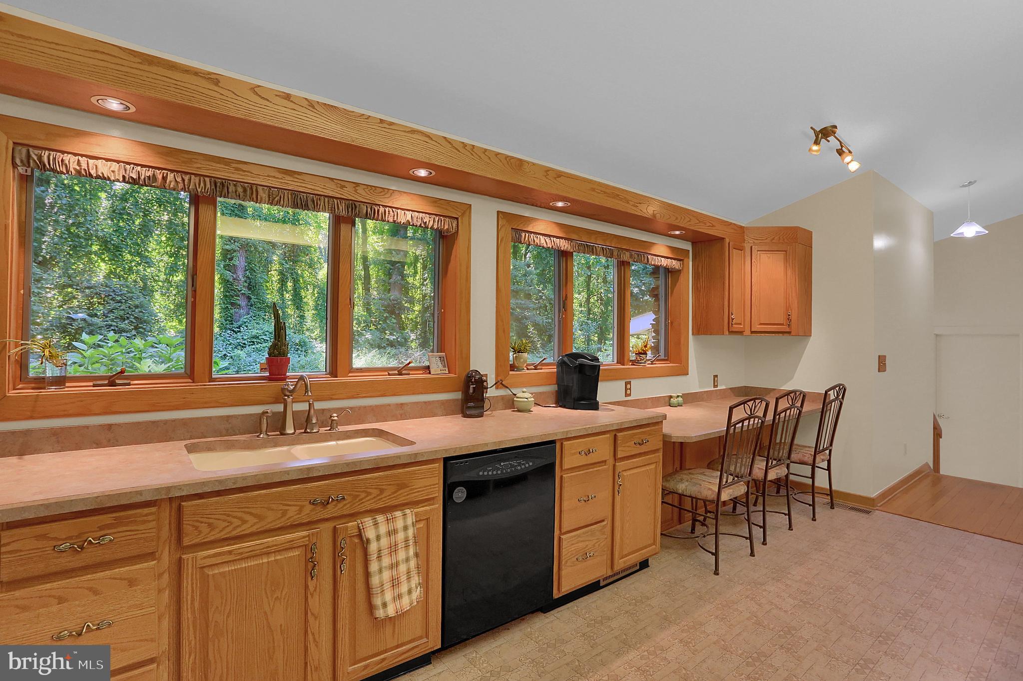 3336 Offutt Road Randallstown, MD 21133 - Photo 11 of 45 a kitchen with a sink and a large window
