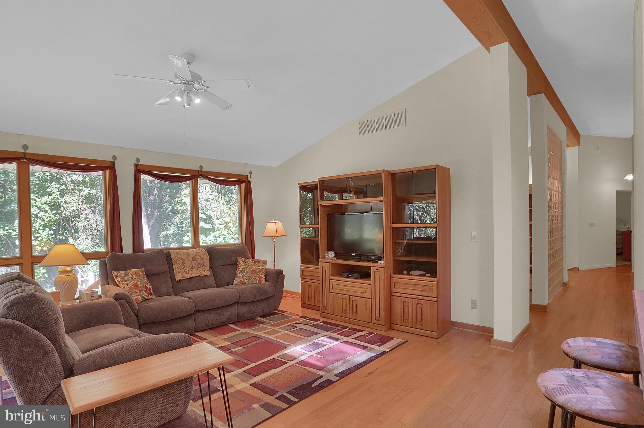 3336 Offutt Road Randallstown, MD 21133 - Photo 16 of 45 a living room with furniture and a flat screen tv