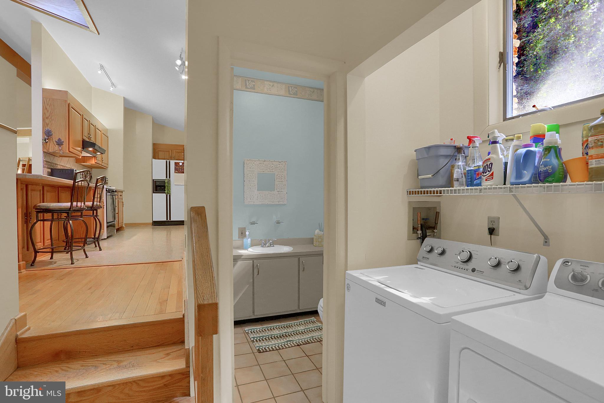 3336 Offutt Road Randallstown, MD 21133 - Photo 20 of 45 a utility room with cabinets washer and dryer