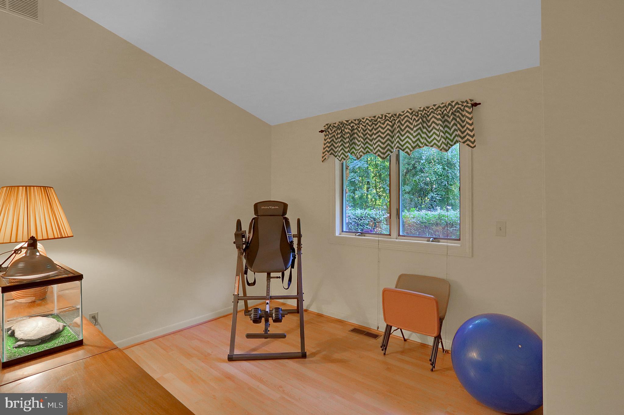 3336 Offutt Road Randallstown, MD 21133 - Photo 30 of 45 a workspace room with furniture and wooden floor