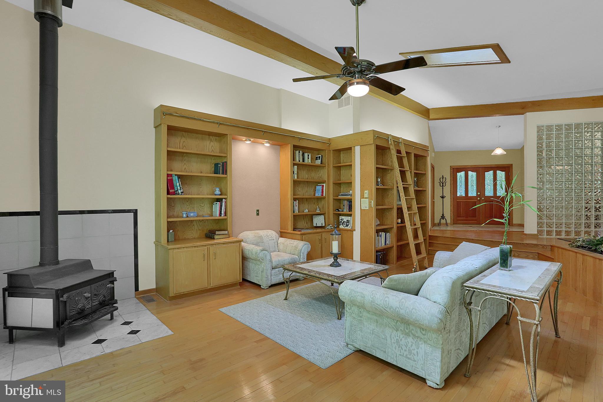 3336 Offutt Road Randallstown, MD 21133 - Photo 5 of 45 a living room with furniture and a ceiling fan