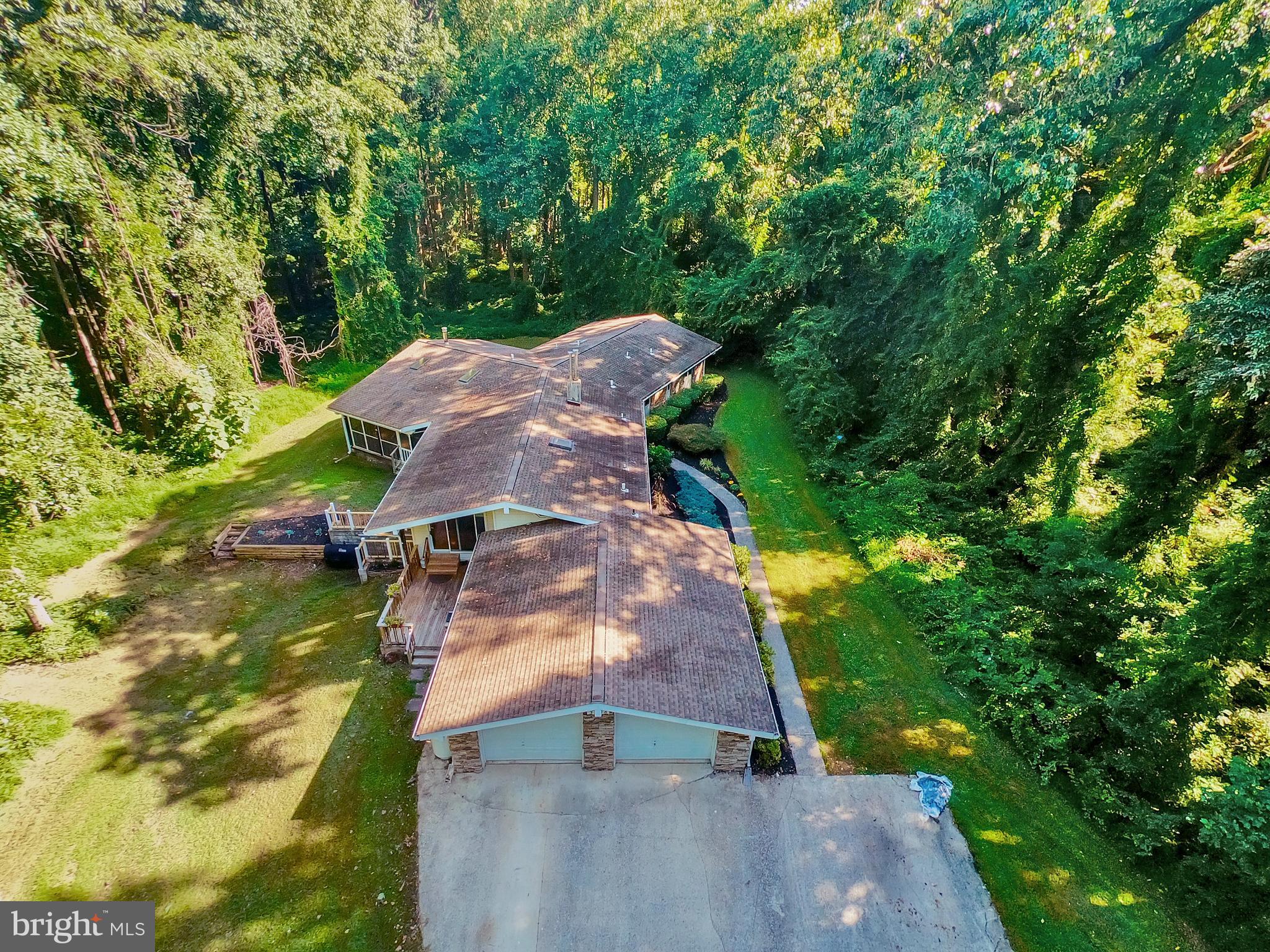 3336 Offutt Road Randallstown, MD 21133 - Photo 41 of 45 an aerial view of a house with a yard and trees