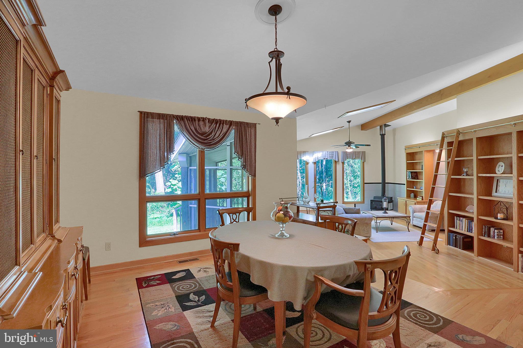 3336 Offutt Road Randallstown, MD 21133 - Photo 8 of 45 a dining room with furniture window and wooden floor
