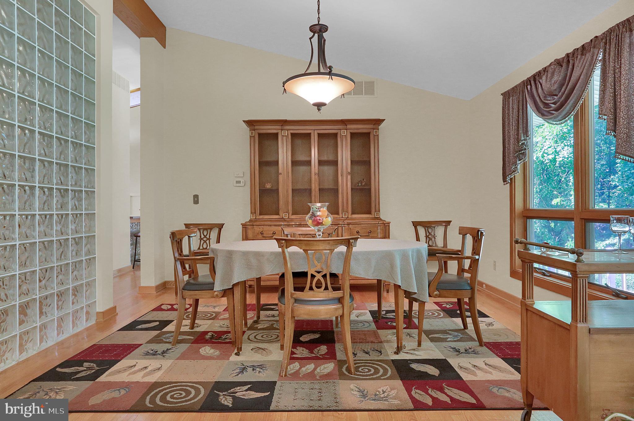 3336 Offutt Road Randallstown, MD 21133 - Photo 9 of 45 a view of a dining room with furniture window and wooden floor