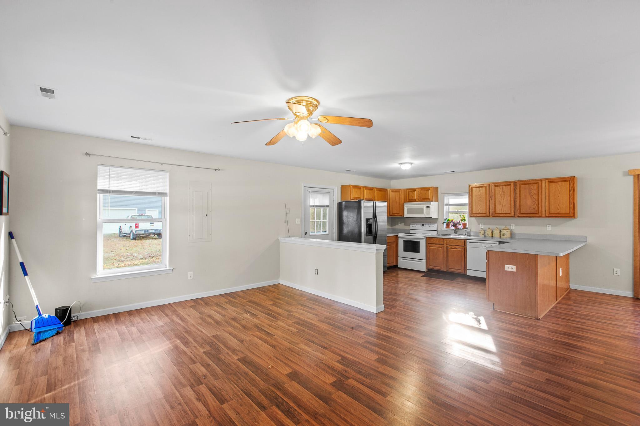 16197 Thomas Road Piney Point, MD 20674 - Photo 3 of 15 a living room with furniture and a flat screen tv