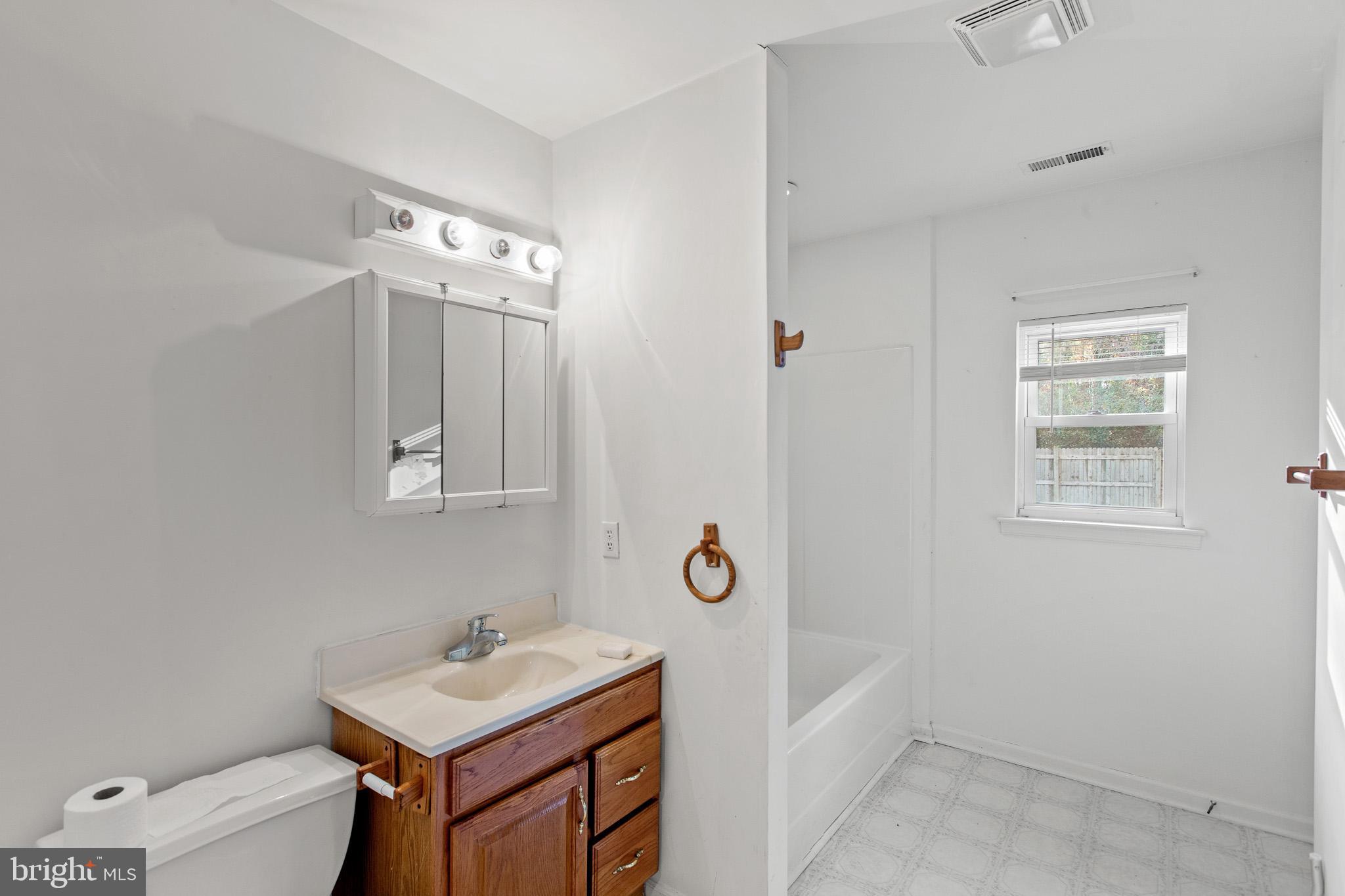 16197 Thomas Road Piney Point, MD 20674 - Photo 6 of 15 a bathroom with a sink toilet and shower