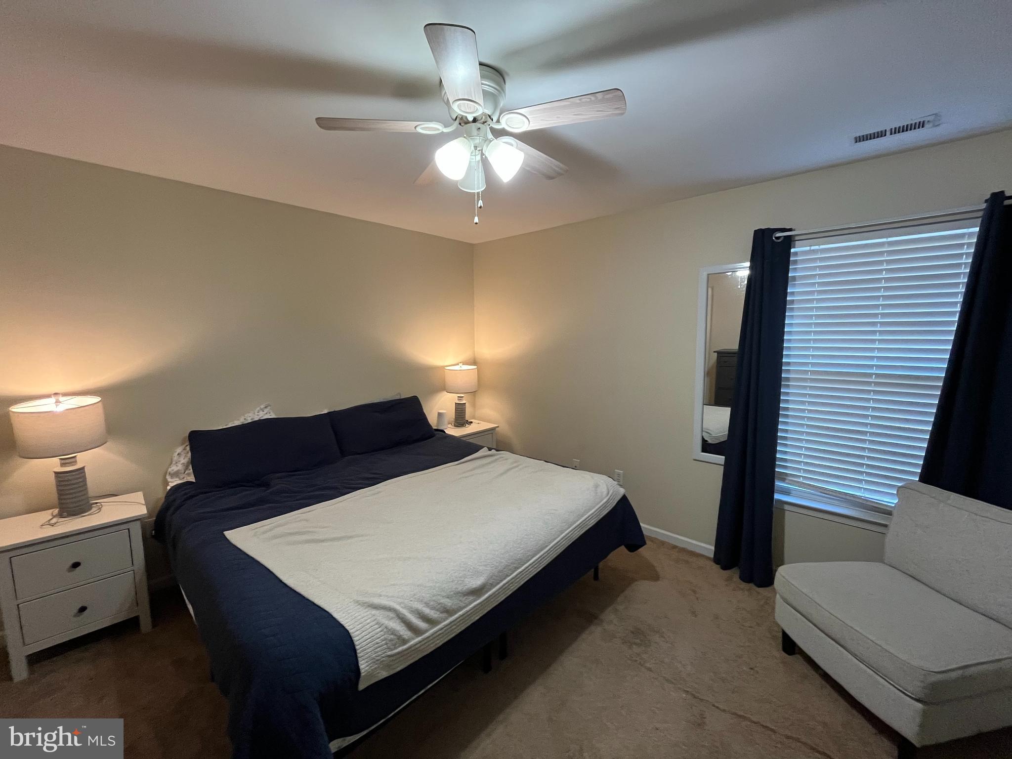 16197 Thomas Road Piney Point, MD 20674 - Photo 9 of 15 a bedroom with a bed and window