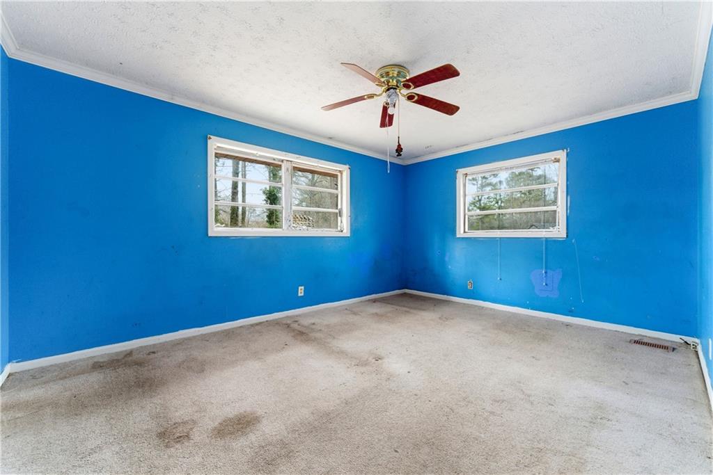 948 Powder Springs Street Marietta, GA 30064 - Photo 11 of 24 a view of an empty room with a window
