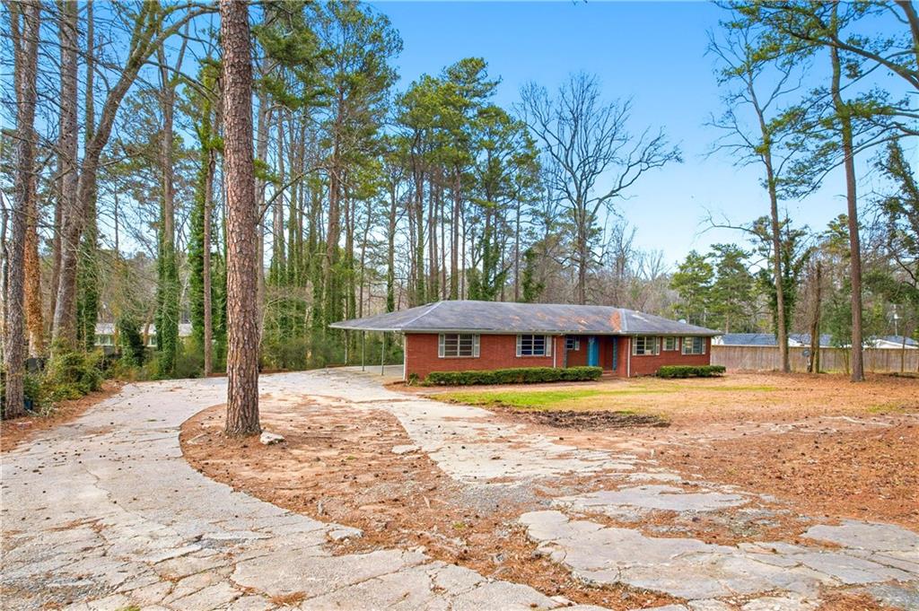 948 Powder Springs Street Marietta, GA 30064 - Photo 14 of 24 a house with trees in the background