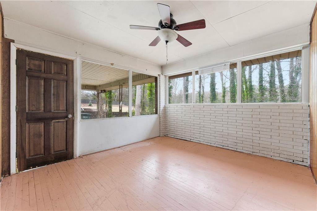 948 Powder Springs Street Marietta, GA 30064 - Photo 16 of 24 a view of an empty room with a window