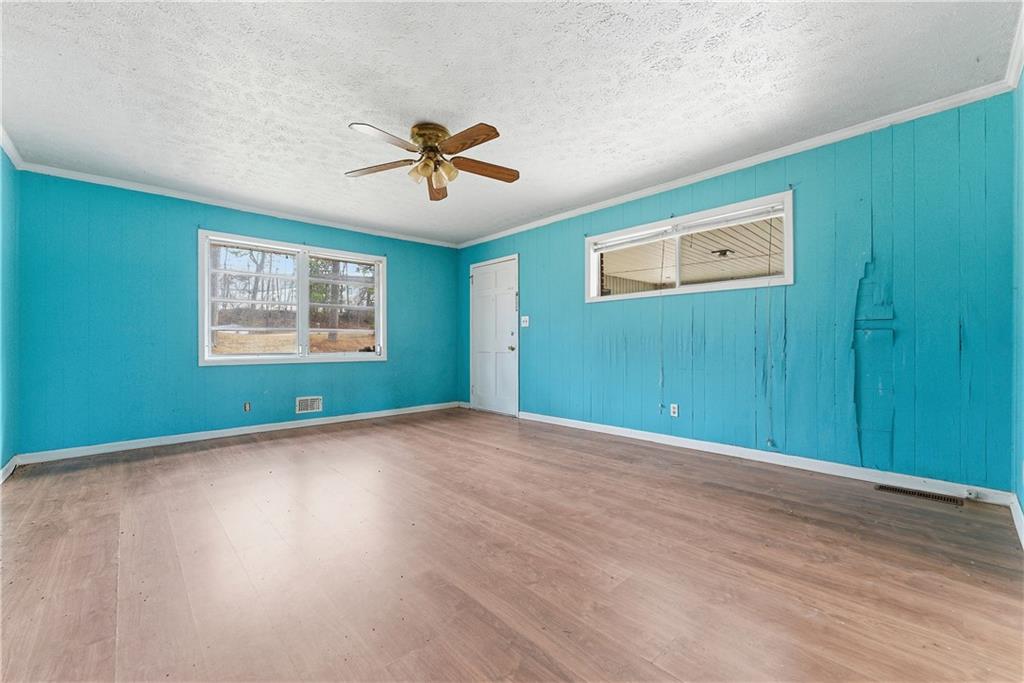 948 Powder Springs Street Marietta, GA 30064 - Photo 18 of 24 a view of empty room with wooden floor and fan