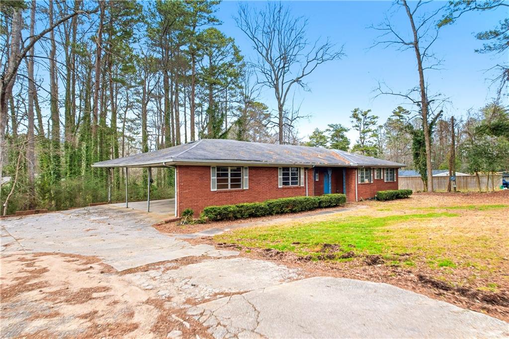 948 Powder Springs Street Marietta, GA 30064 - Photo 20 of 24 a front view of a house with a yard