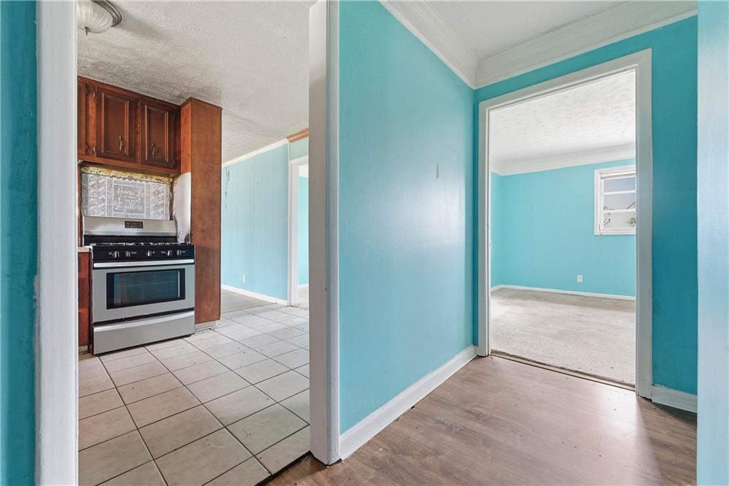 948 Powder Springs Street Marietta, GA 30064 - Photo 21 of 24 a view of kitchen with cabinets and stove