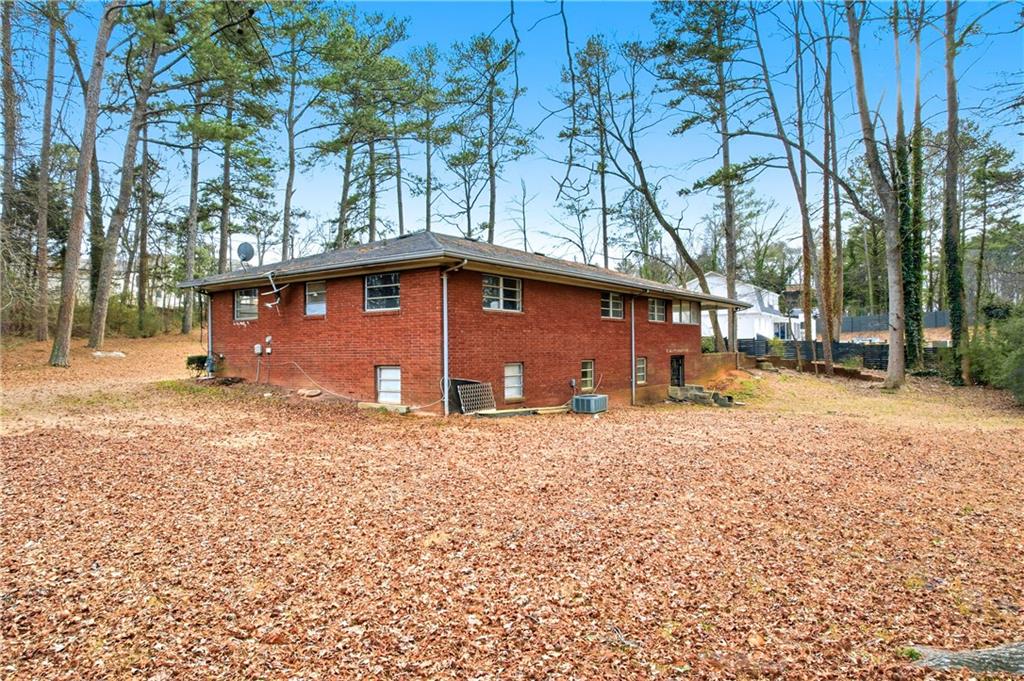 948 Powder Springs Street Marietta, GA 30064 - Photo 22 of 24 a front view of a house with a yard