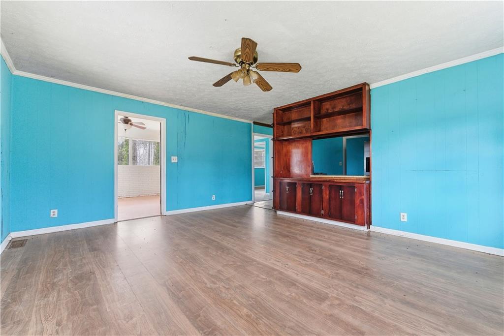 948 Powder Springs Street Marietta, GA 30064 - Photo 3 of 24 a view of an empty room with window and wooden floor